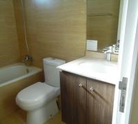 dormitorio principal en suite con walking closet