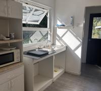 cocina separada del comedor y living