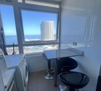 comedor de diario y área de lavado con vista al mar