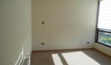 dormitorio principal en suite con walking closet