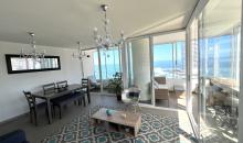 amplio living comedor con esplendida vista al mar
