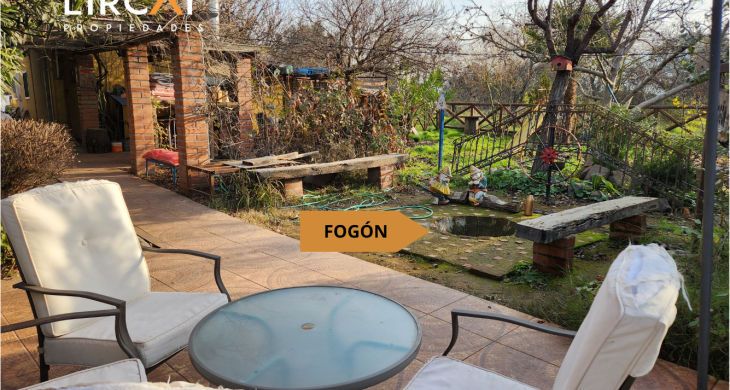 amplio terreno con pérgola para descansos en familia